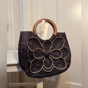 Mar y sol Guadalupe’s floral raffia tote. Wooden handles.
